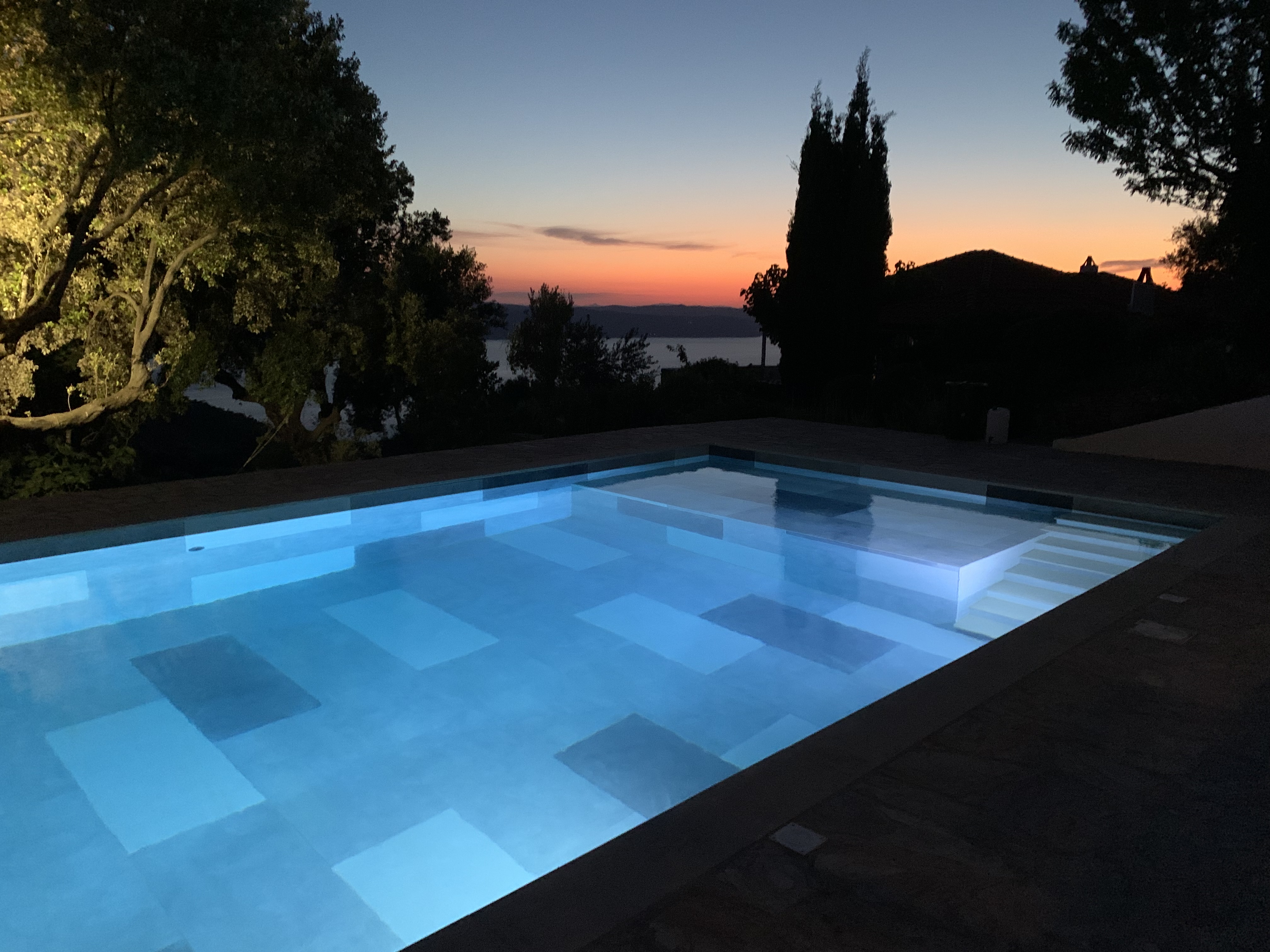 Swimming pool at sunset